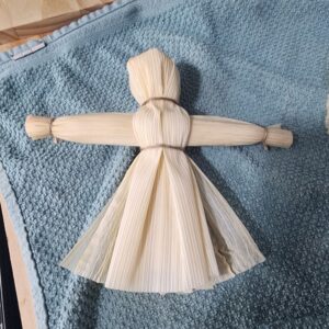 Mabon Preparations: Easy Crafts & Rituals for the Autumn Equinox 6 A corn husk doll tied with twine