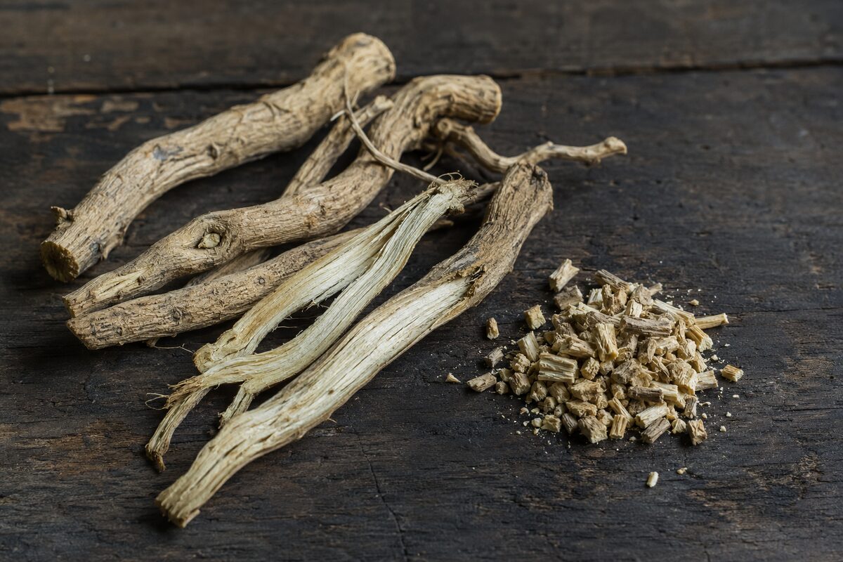 Top 10 Best Herbal Teas for Cold & Flu Season 11 Whole and chopped dried marshmallow root on a wooden surface